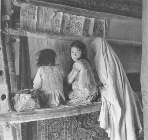 Girls weaving a carpet in hamdan 1922